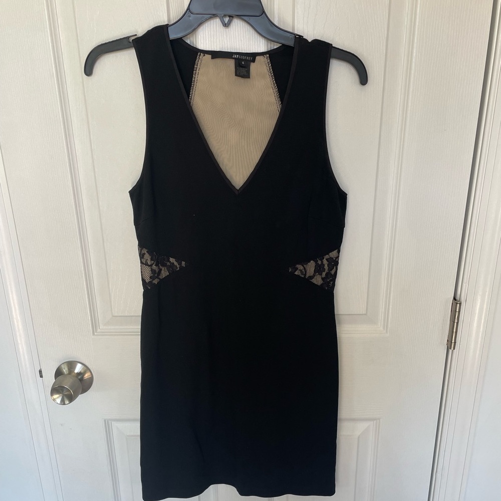 Mini black dress size 4 with lace back.